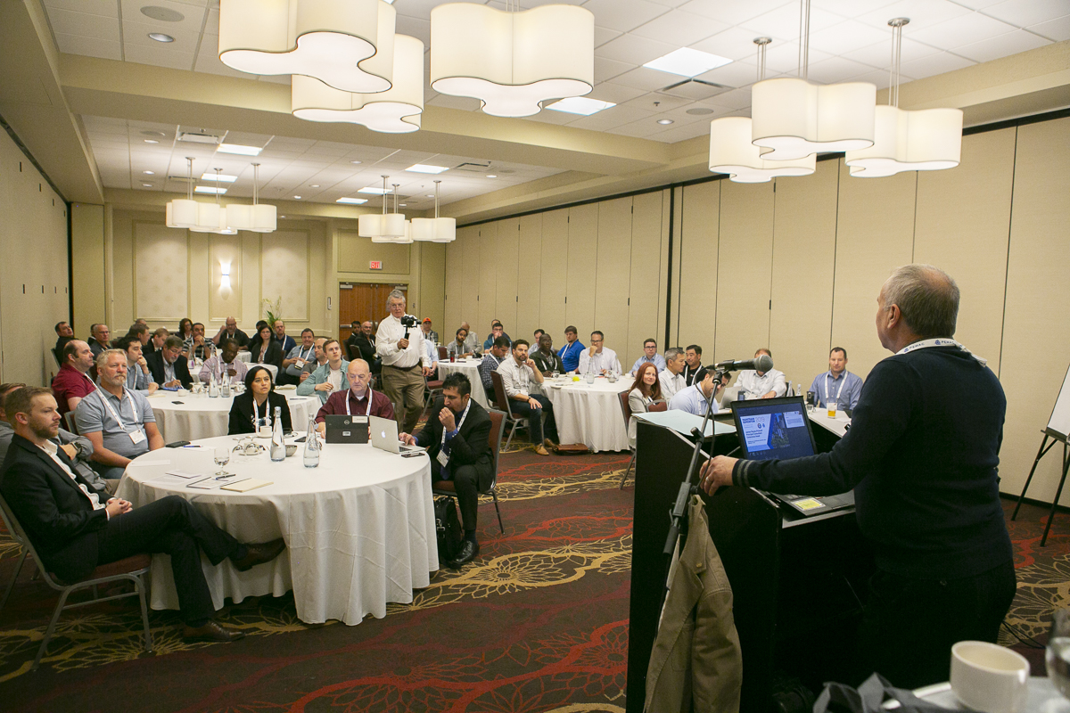 A room full eagerly learning from James Reyes-Picknell's presentation