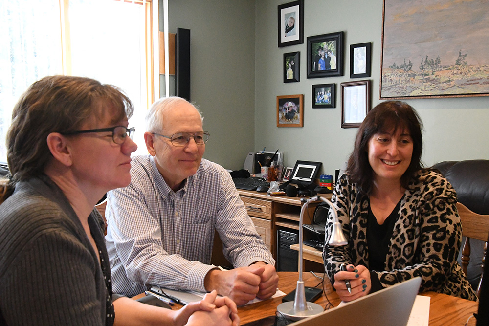 The western Board Members together with the Executive Director around the table in Calgary.